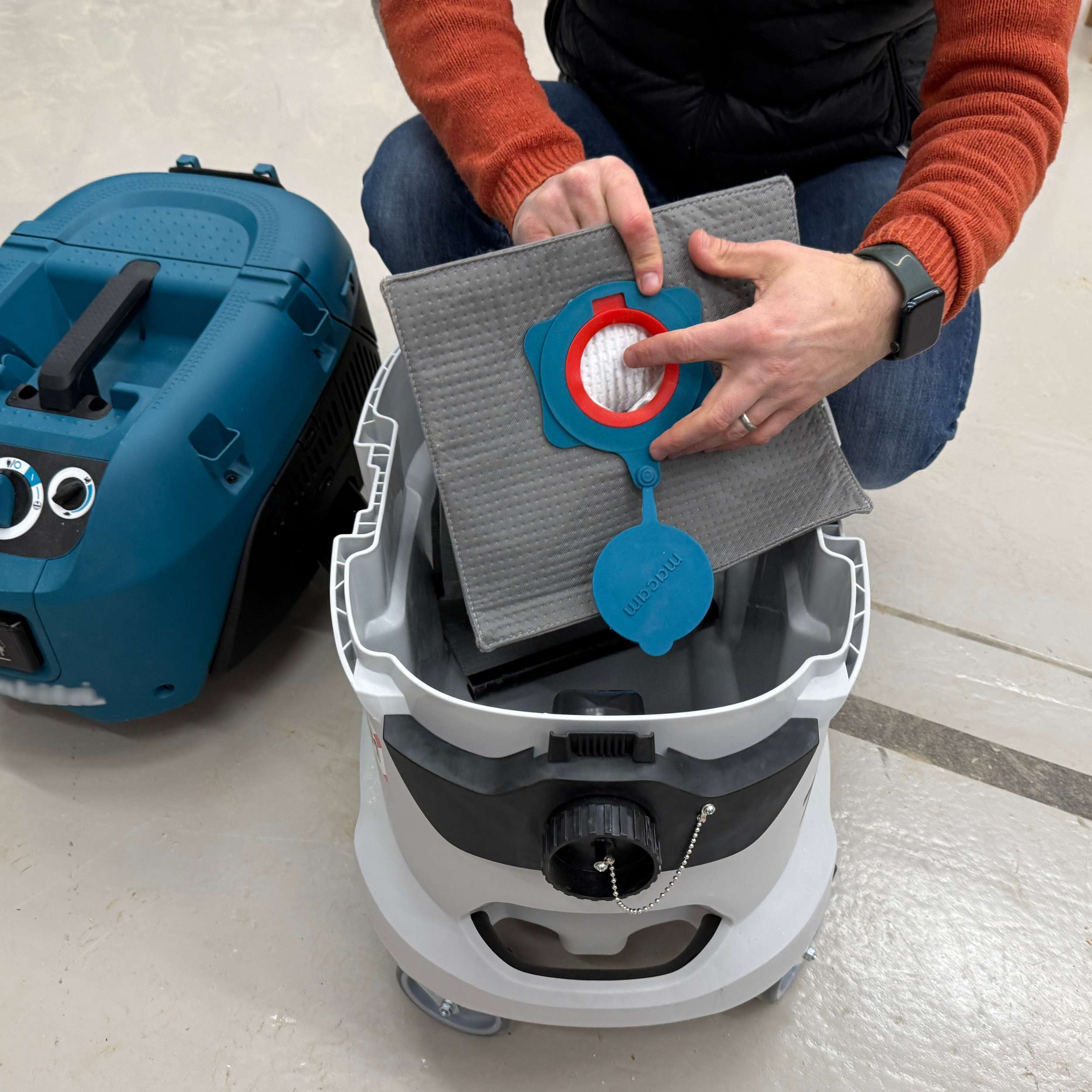 Close-up of the reusable dust bag fabric and collar for Makita VC4210